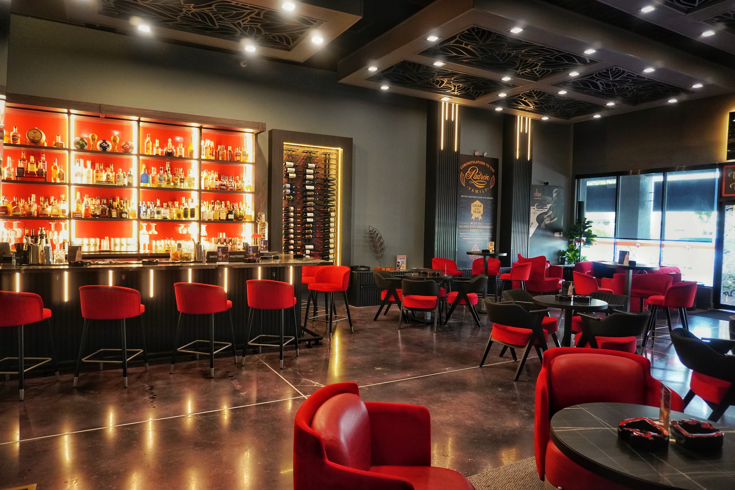 The lounge at Sabor Havana in Doral, Miami — red leather seating and the lit bar