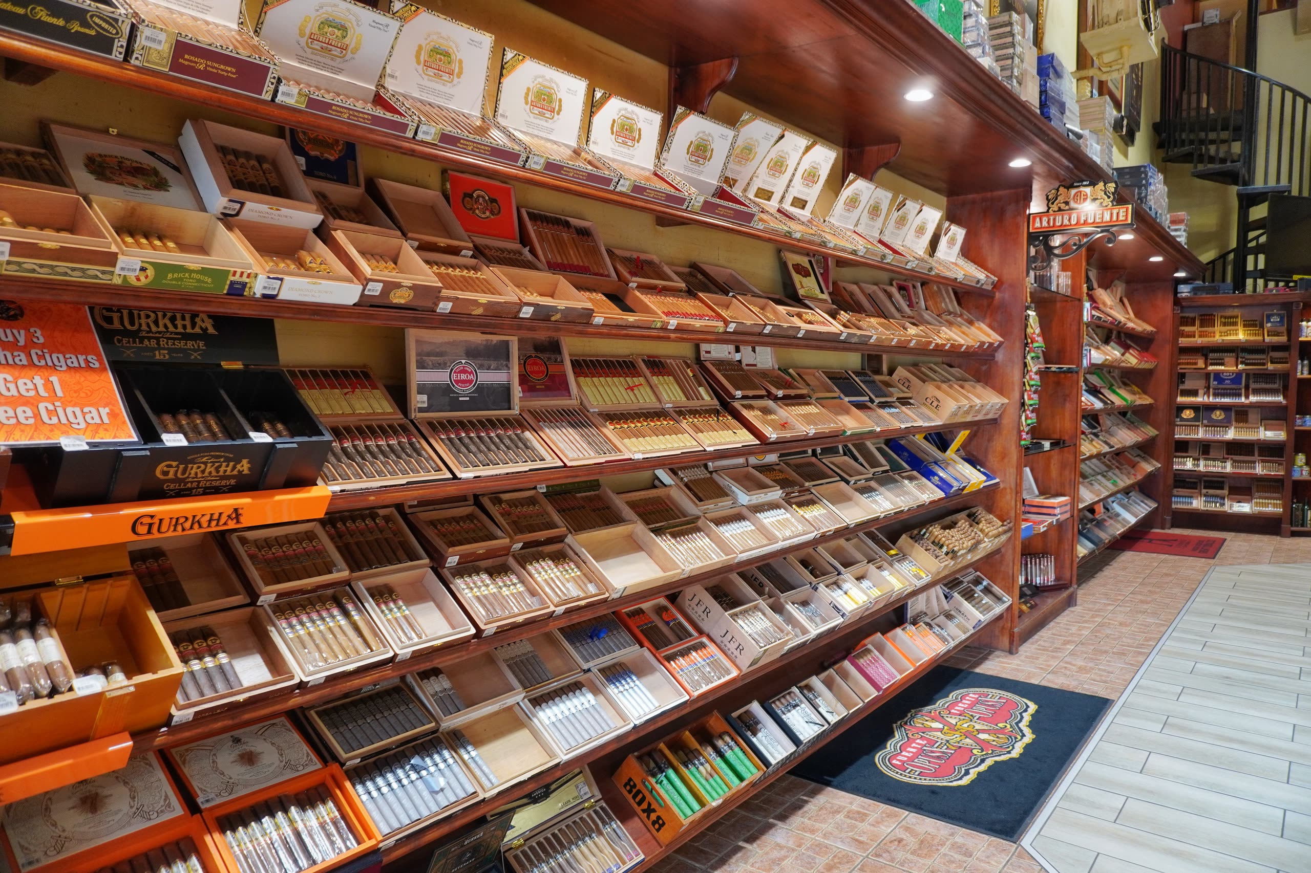 Walls of open cigar boxes inside the walk-in humidor at Sabor Havana in Doral, Miami