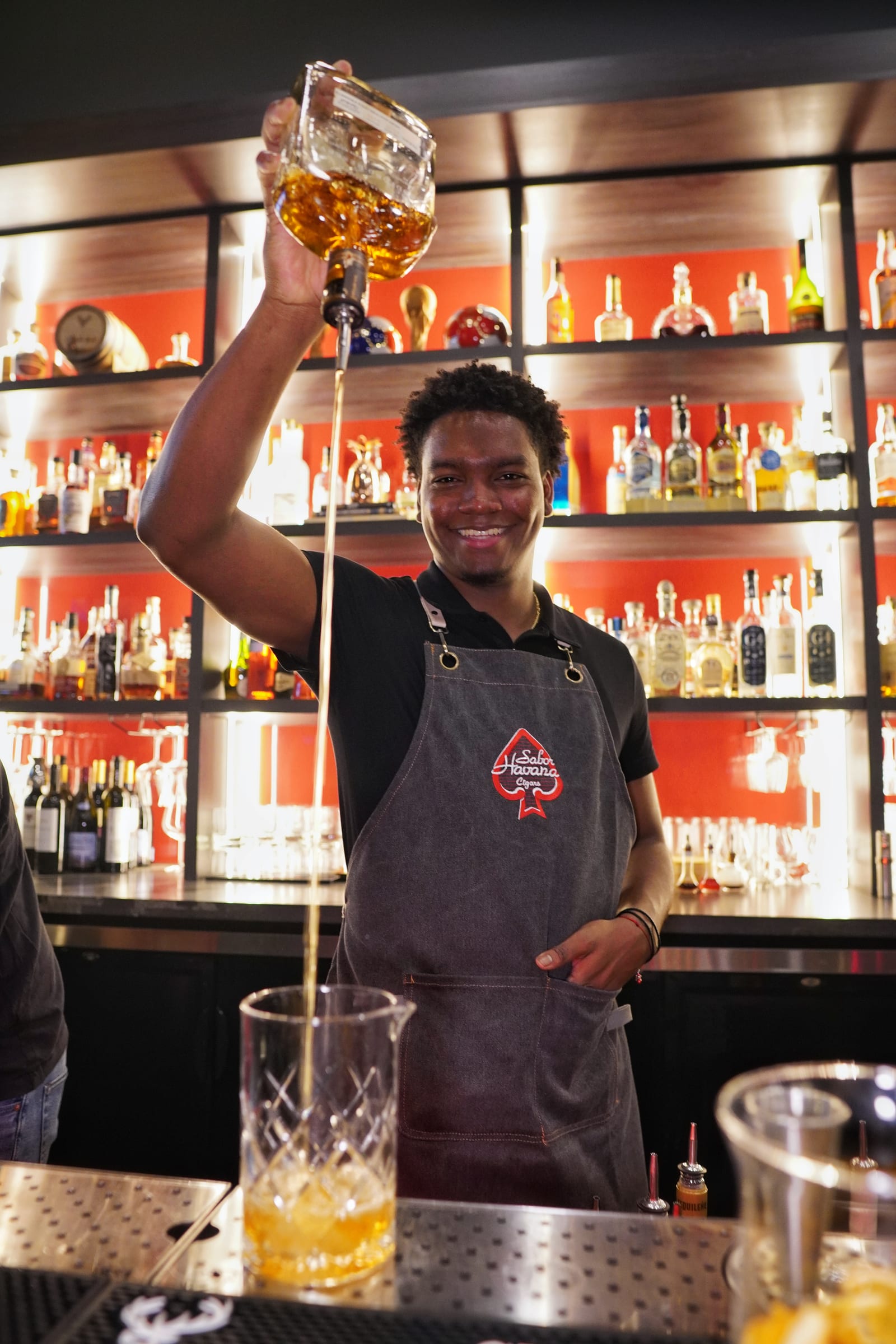 Bartender pouring a cocktail at Sabor Havana in Doral, Miami