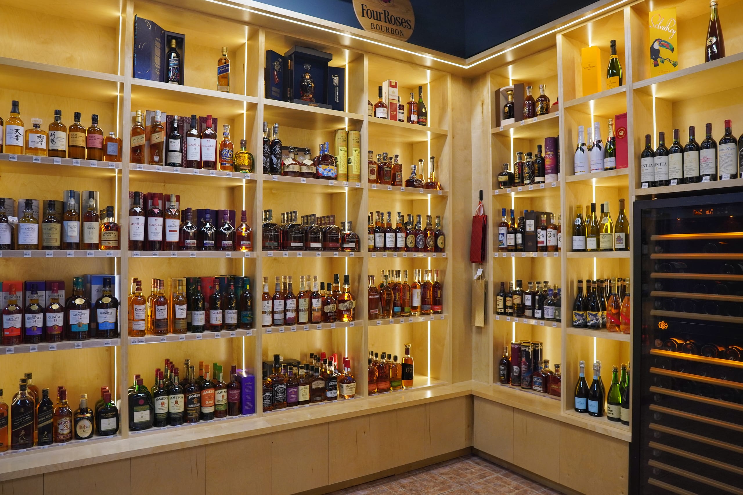 Floor-to-ceiling liquor shelves at Sabor Havana Liquor Express in Doral, Miami