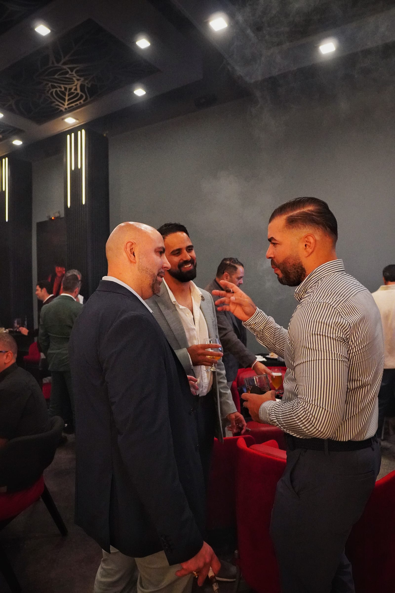 Guests talking over cigars in the lounge at Sabor Havana in Doral, Miami